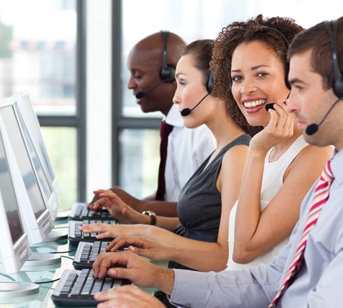 A group of people working on computers