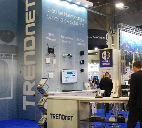 A person standing in front of the TRENDnet booth.